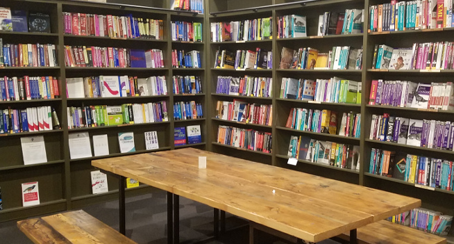 Wall-to-wall bookcases in the back reading room